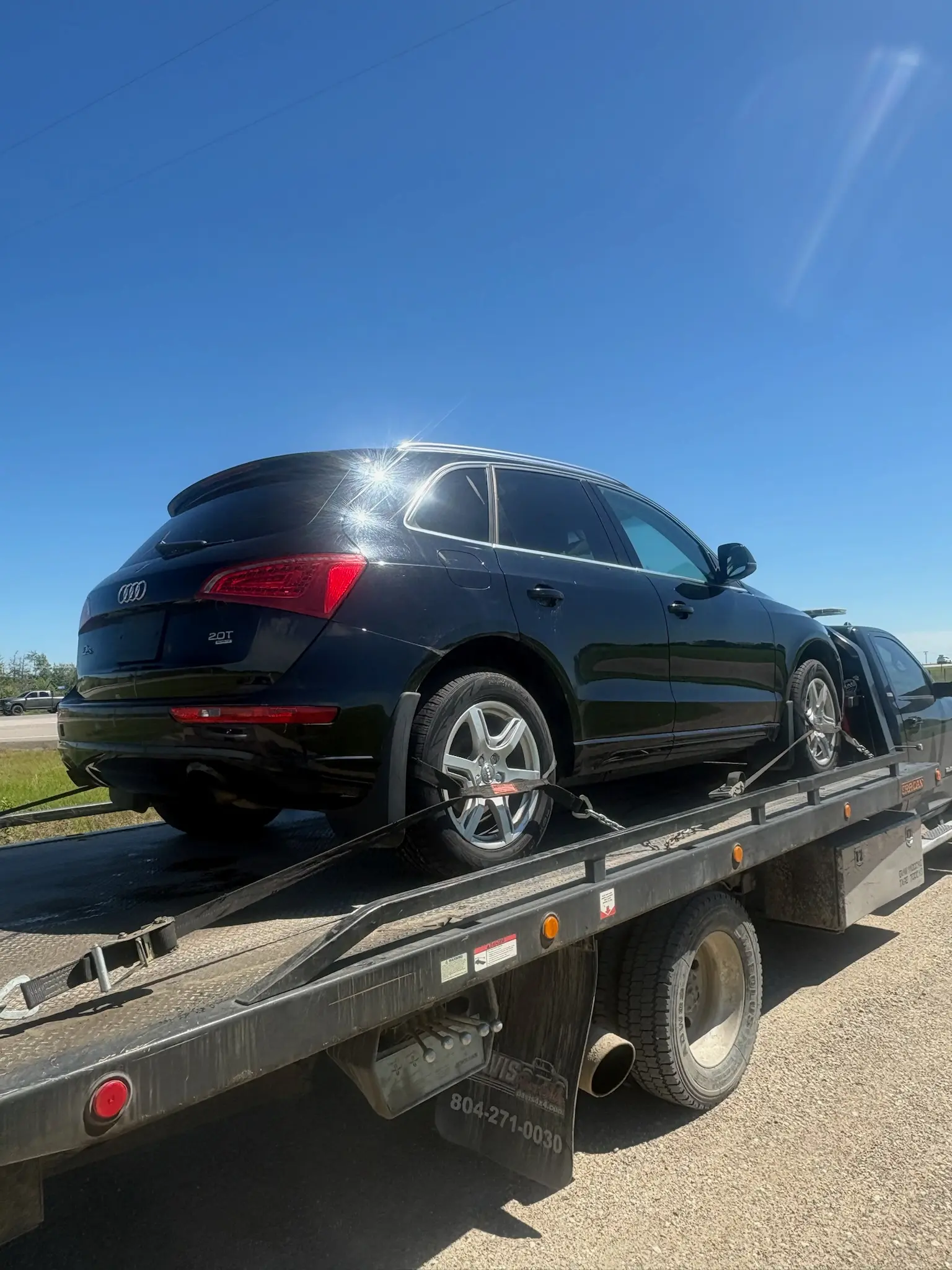 Red Deer Car Buyers loading a purchased vehicle